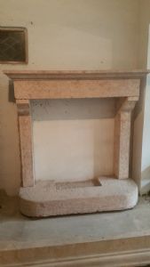 Red bocciardato marble fireplace with shelves